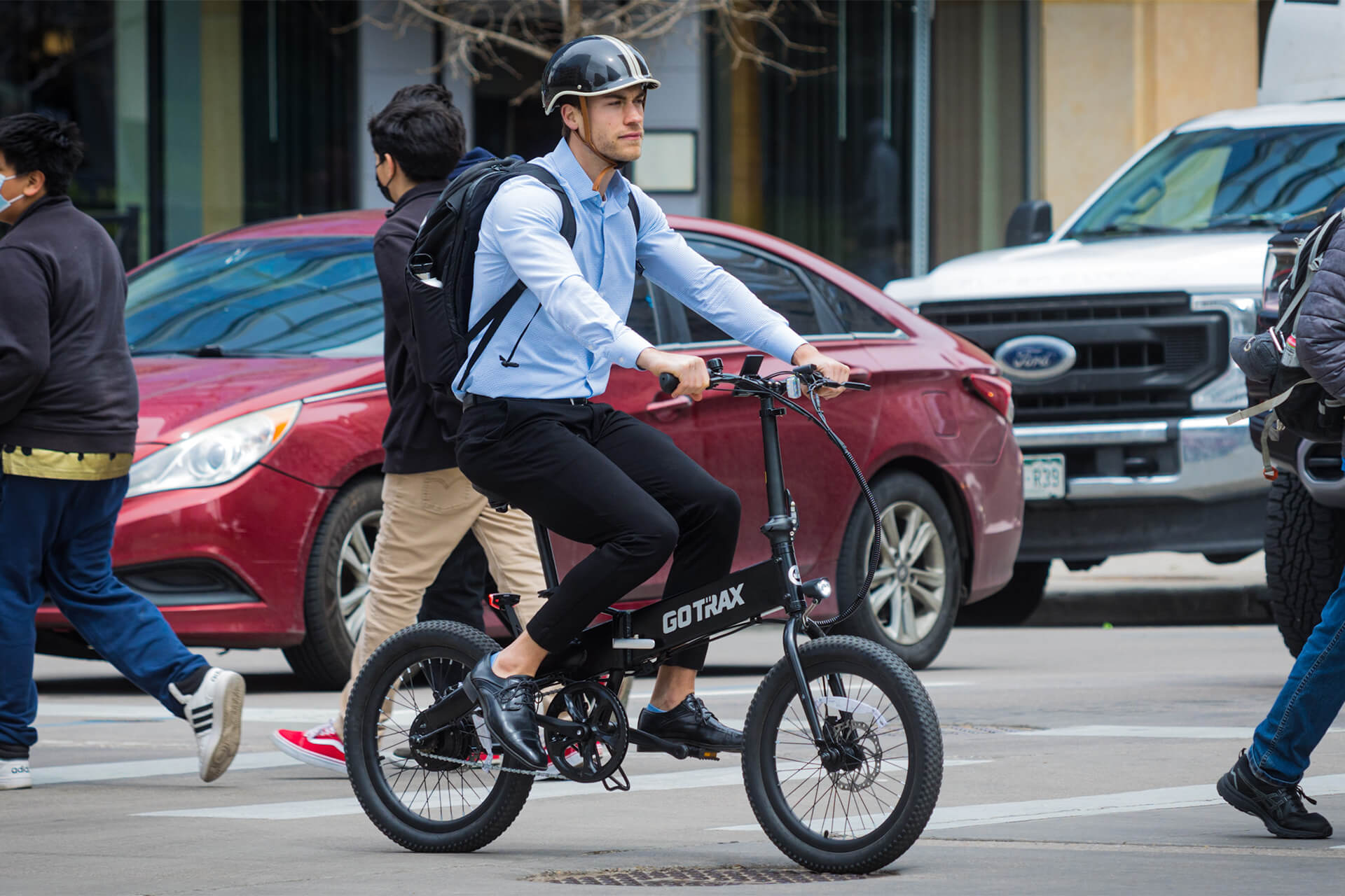 Man riding a GOTRAX F1 Foldable Electric Bike