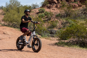 Man riding Off-Road on a GOTRAX F5 Foldable Electric Bike for Adults with Fat Tires and Front Wheel Suspension