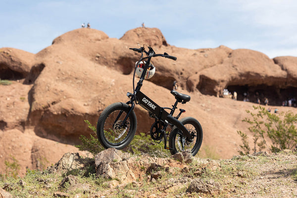 The GOTRAX F1 Foldable Electric Bike on a Hill