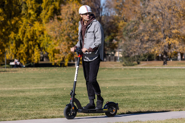Man riding GOTRAX G4 Commuter Electric Scooter