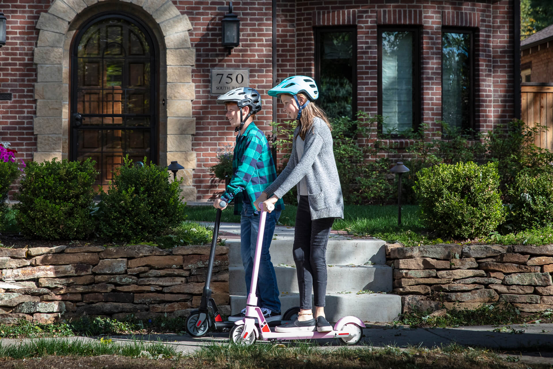 Children riding GOTRAX GKS Electric Scooter for Kids