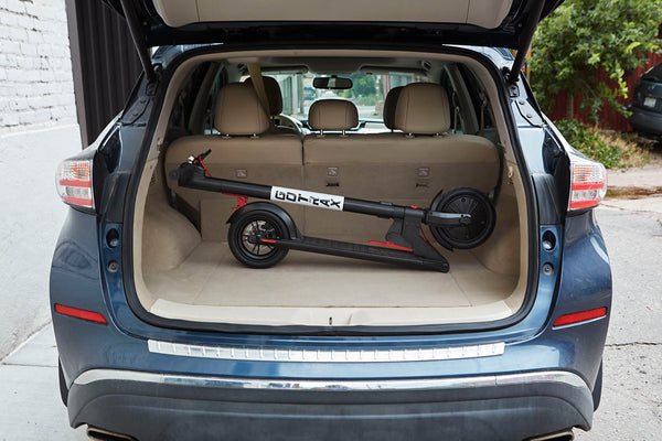 The GOTRAX GXL V2 Casual Electric Scooter in the Folded Position in the Back of a Car