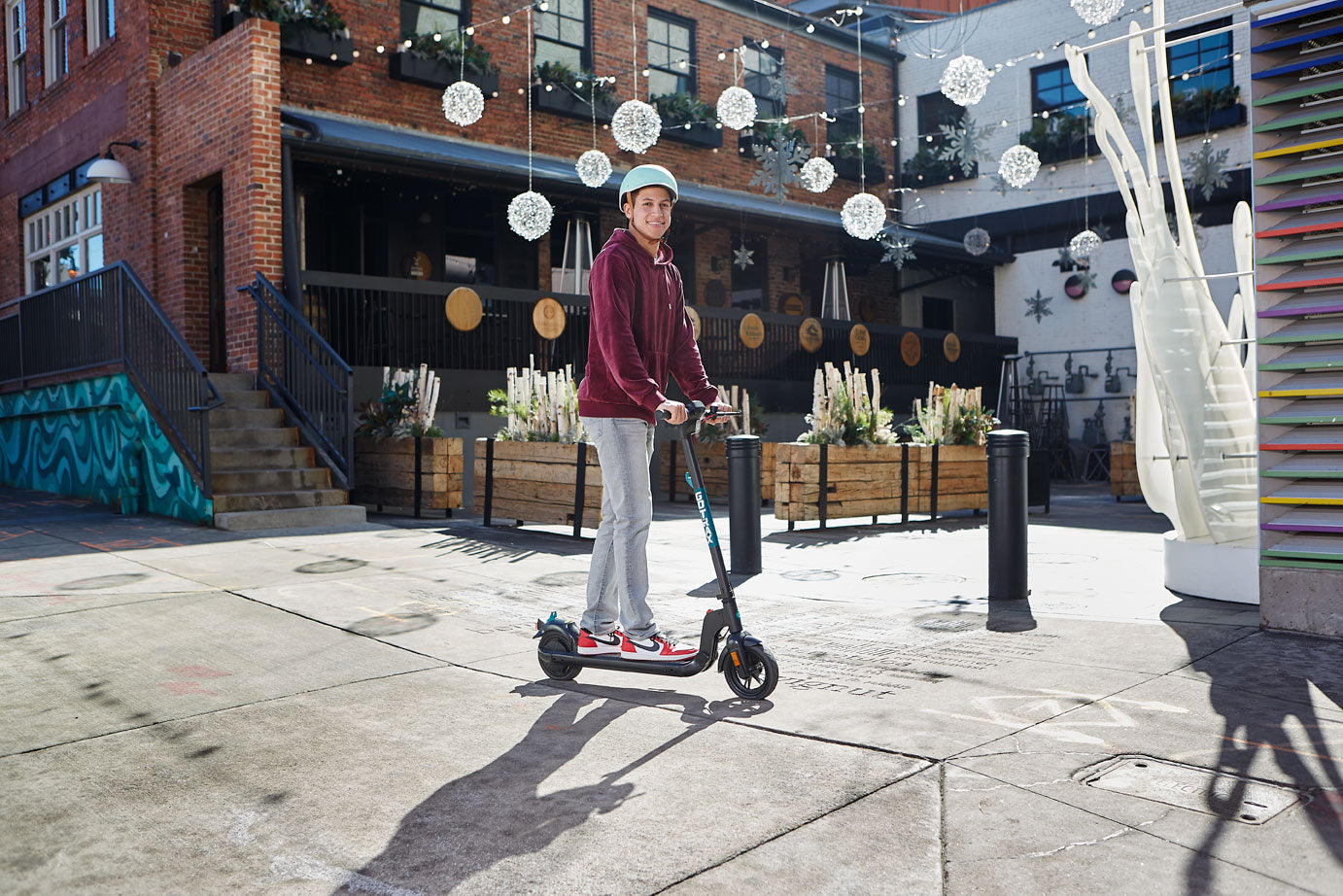 Man riding a GOTRAX Apex Entry Level Electric Scooter 